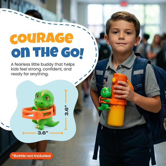 Green dino-shaped dinosaur water bottle accessory with orange adjustable silicone strap on yellow bottle held by boy in school uniform
